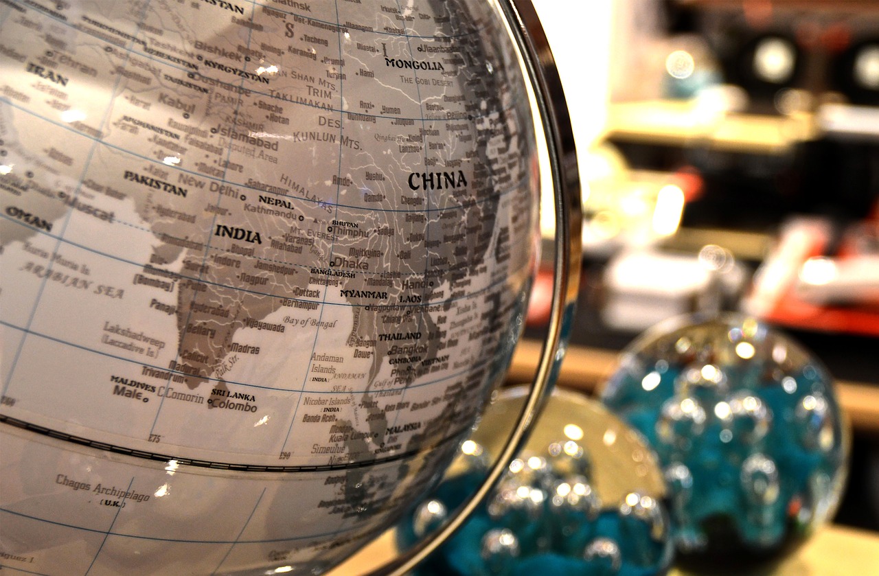 globe with India and China with stationery in the background